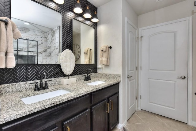 bathroom featuring tasteful backsplash, vanity, and tile patterned flooring