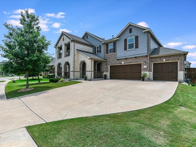 1533 Cresson Trl, Leander, TX 78641 - view of front of house with driveway, a front yard, stone siding, brick siding, and an attached garage
