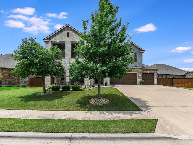 1533 Cresson Trl, Leander, TX 78641 - view of front of property with stone siding, concrete driveway, a garage, and a balcony