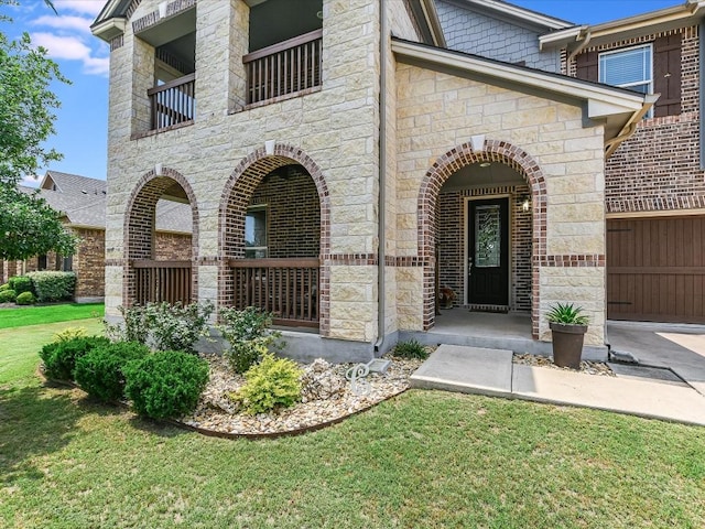 1533 Cresson Trl, Leander, TX 78641 - doorway to property featuring stone siding, a lawn, and a garage