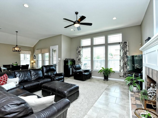 1533 Cresson Trl, Leander, TX 78641 - living room featuring a fireplace, a ceiling fan, baseboards, recessed lighting, and vaulted ceiling