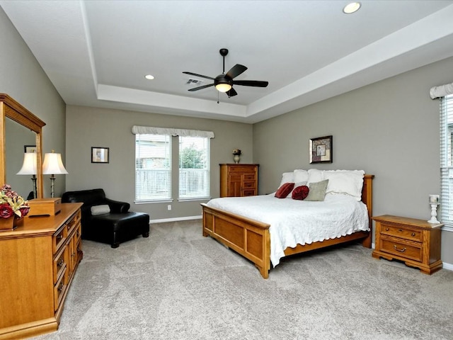 1533 Cresson Trl, Leander, TX 78641 - bedroom with light colored carpet, a tray ceiling, recessed lighting, and a ceiling fan