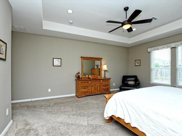 1533 Cresson Trl, Leander, TX 78641 - carpeted bedroom with a raised ceiling, baseboards, and a ceiling fan
