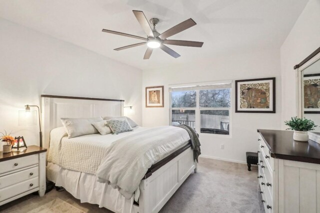 bedroom with light colored carpet and ceiling fan