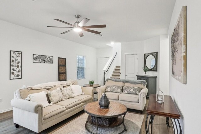living room featuring hardwood / wood-style flooring and ceiling fan