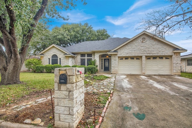 ranch-style house featuring a garage and a front lawn