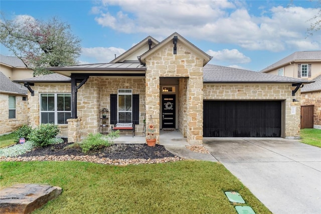 view of front of property with a garage and a front yard