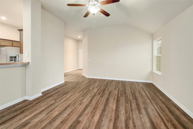 18825 Golden Eagle Way, Elgin, TX 78621 - unfurnished living room with ceiling fan, wood finished floors, recessed lighting, and vaulted ceiling