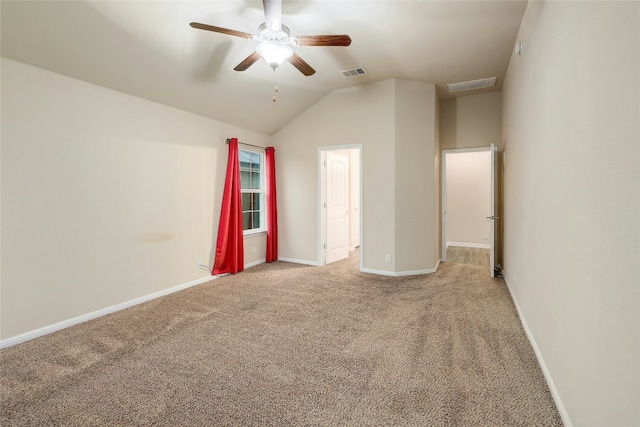 18825 Golden Eagle Way, Elgin, TX 78621 - spare room featuring light carpet, ceiling fan, and vaulted ceiling