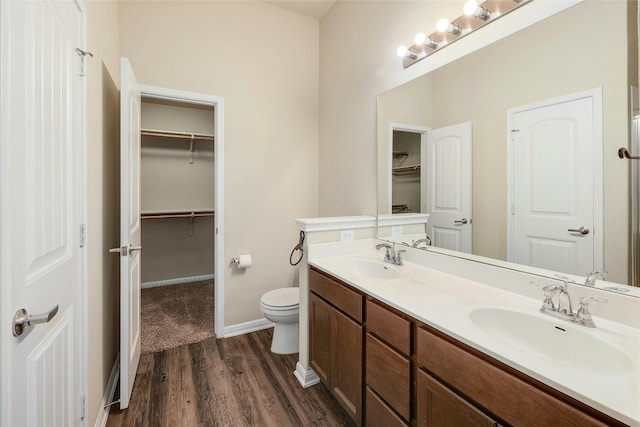 18825 Golden Eagle Way, Elgin, TX 78621 - full bath featuring wood finished floors, double vanity, and a spacious closet
