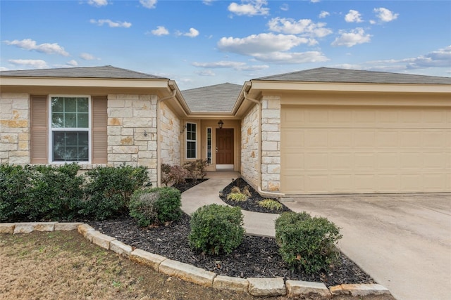 18825 Golden Eagle Way, Elgin, TX 78621 - ranch-style house featuring stone siding, an attached garage, driveway, and roof with shingles