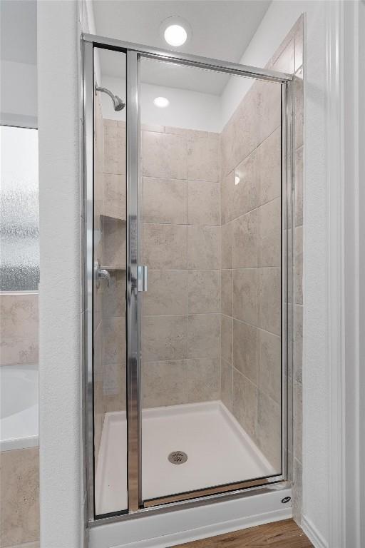 501 Bluejack Way, Hutto, TX 78634 - full bathroom with a shower stall and a garden tub