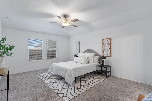 bedroom featuring carpet floors, a textured ceiling, baseboards, and a ceiling fan