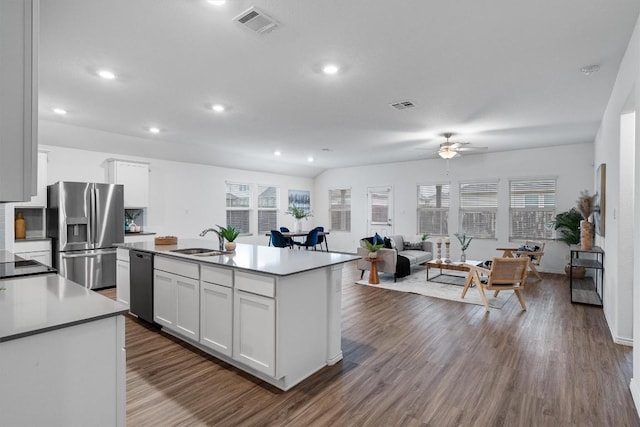 501 Bluejack Way, Hutto, TX 78634 - kitchen featuring stainless steel refrigerator with ice dispenser, dishwasher, plenty of natural light, white cabinets, and recessed lighting
