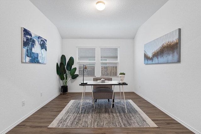 501 Bluejack Way, Hutto, TX 78634 - home office with vaulted ceiling, dark wood-style flooring, and baseboards