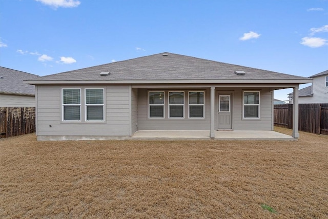 501 Bluejack Way, Hutto, TX 78634 - rear view of property with a patio area and roof with shingles