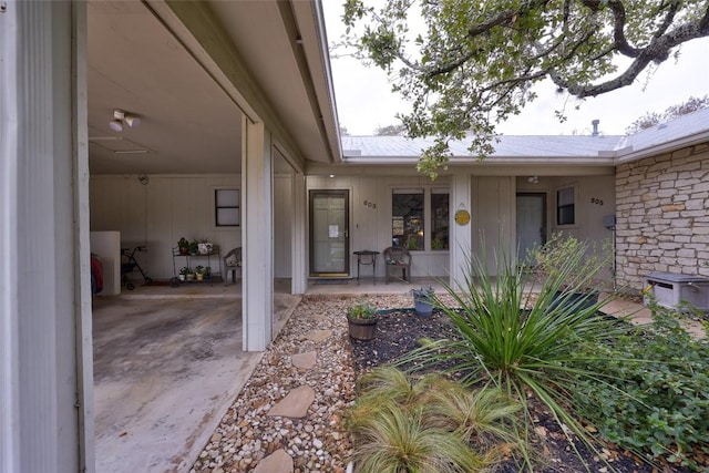 803 Castle Ridge Rd, Austin, TX 78746 - doorway to property featuring a patio and a metal roof