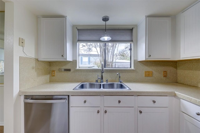803 Castle Ridge Rd, Austin, TX 78746 - kitchen featuring stainless steel dishwasher, white cabinets, pendant lighting, and light countertops