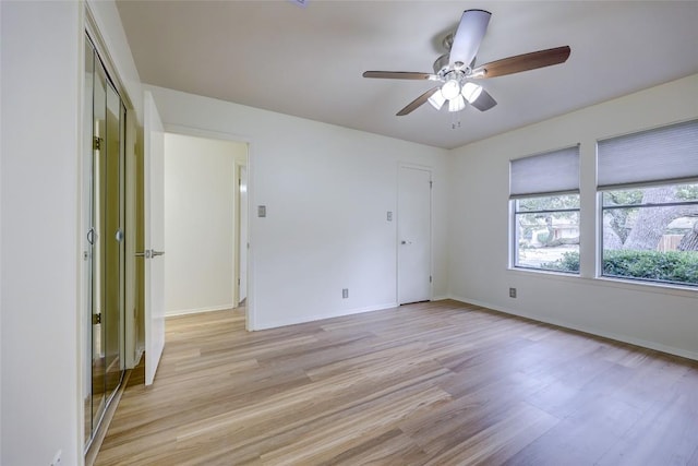 unfurnished room featuring ceiling fan and light hardwood / wood-style floors