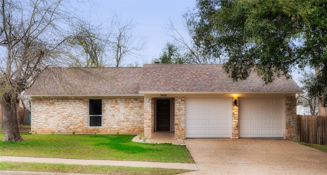 single story home featuring a garage and a front yard