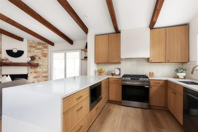 kitchen with built in microwave, sink, tasteful backsplash, stainless steel range with gas stovetop, and dishwasher