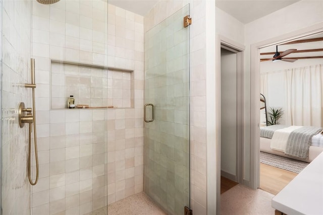 bathroom with ceiling fan and walk in shower