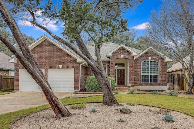 view of front of property with a garage and a front lawn