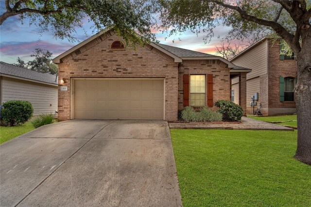 ranch-style home with a yard