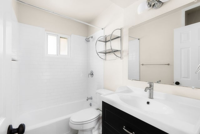 full bathroom with tiled shower / bath combo, vanity, and toilet