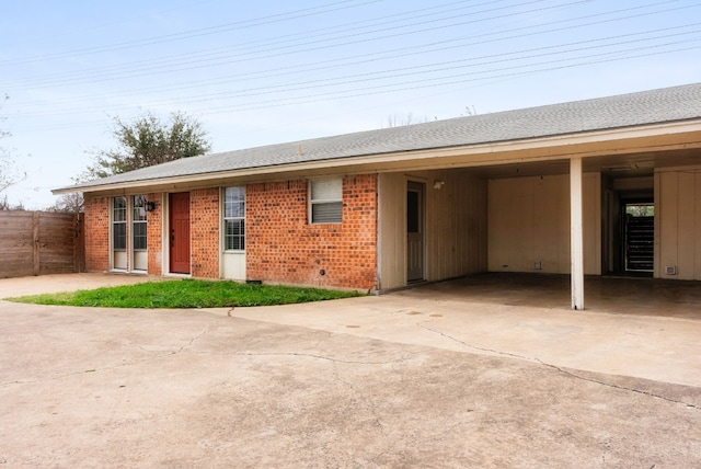 single story home featuring a carport