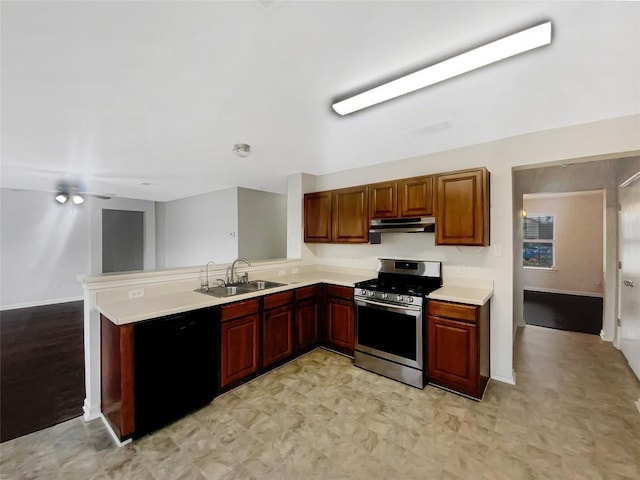 kitchen featuring stainless steel gas stove, dishwasher, light countertops, under cabinet range hood, and a sink