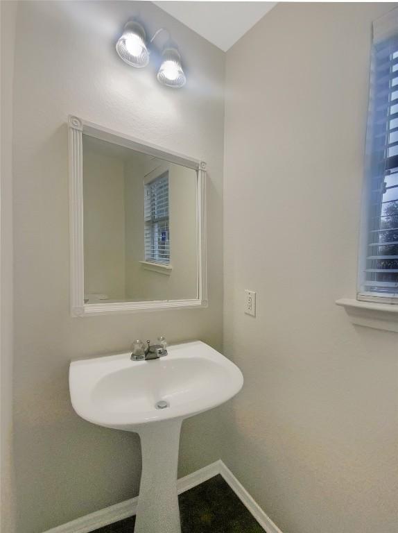 bathroom with baseboards