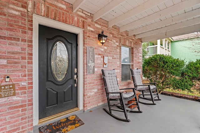 doorway to property featuring a porch