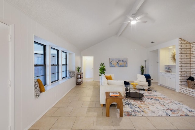 tiled living room with lofted ceiling with beams and ceiling fan