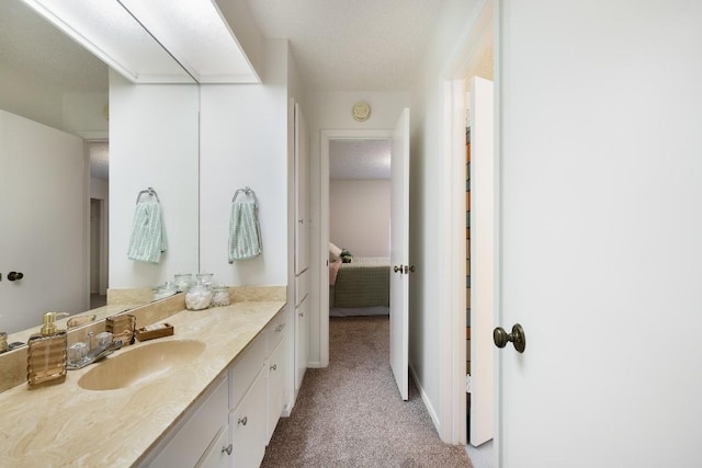 bathroom featuring vanity and a textured ceiling