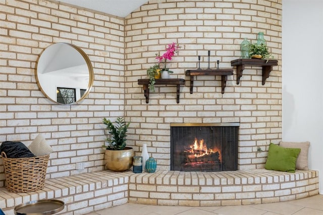 tiled living room with a brick fireplace