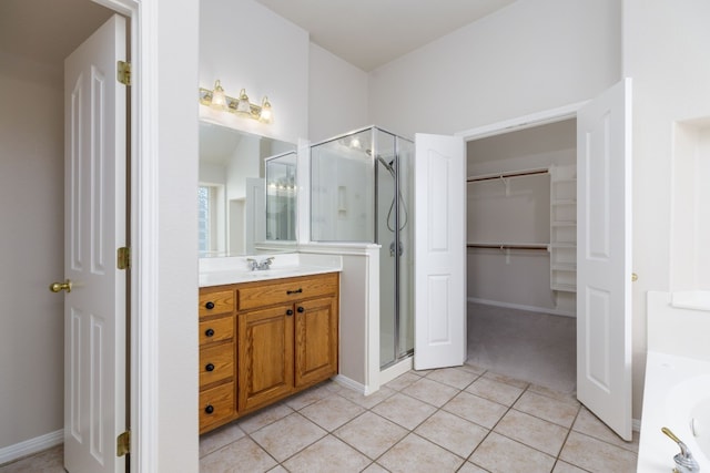 2901 Cashell Wood Dr, Cedar Park, TX 78613 - bathroom with a shower stall, vanity, a walk in closet, tile patterned flooring, and a bath