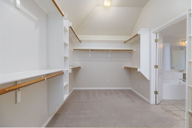 2901 Cashell Wood Dr, Cedar Park, TX 78613 - walk in closet featuring light colored carpet and vaulted ceiling
