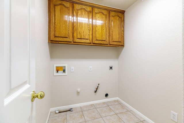 2901 Cashell Wood Dr, Cedar Park, TX 78613 - laundry area with hookup for a gas dryer, cabinet space, washer hookup, hookup for an electric dryer, and light tile patterned floors