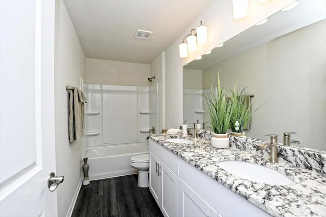 3 Pacific Loon St, Leander, TX 78641 - full bathroom featuring double vanity, wood finished floors, and bathing tub / shower combination