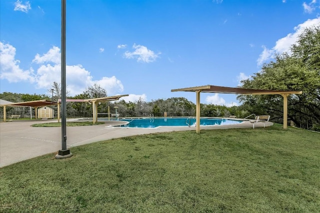 3 Pacific Loon St, Leander, TX 78641 - community pool featuring a storage unit, a lawn, and a patio area
