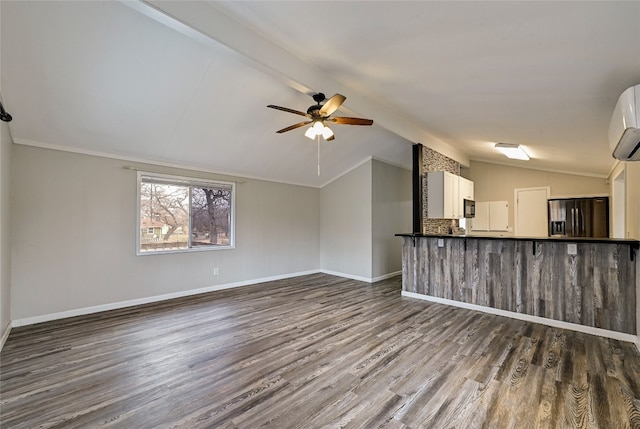 148 W Castleshoals Dr, Granite Shoals, TX 78654 - unfurnished living room featuring ceiling fan, dark wood-type flooring, ornamental molding, vaulted ceiling with beams, and baseboards