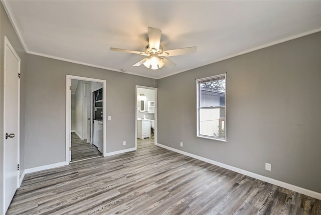 148 W Castleshoals Dr, Granite Shoals, TX 78654 - interior space featuring baseboards, a ceiling fan, ornamental molding, and wood finished floors