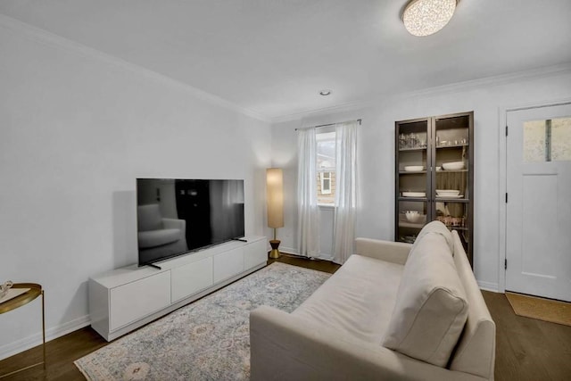 living room featuring ornamental molding, dark hardwood / wood-style floors, and a wealth of natural light