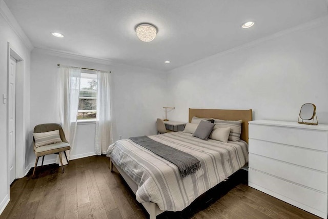 bedroom featuring ornamental molding and dark hardwood / wood-style flooring