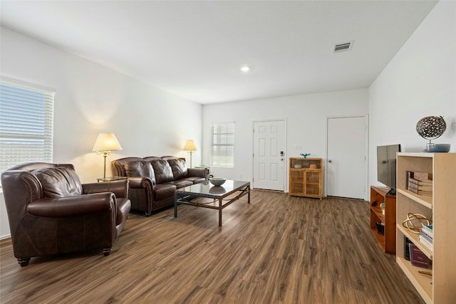 living room featuring dark hardwood / wood-style floors