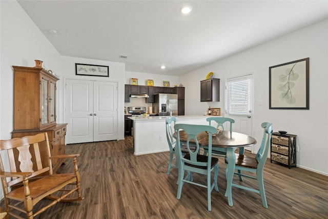 dining room with dark hardwood / wood-style flooring