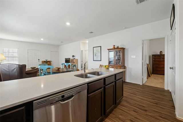 kitchen with dark hardwood / wood-style flooring, sink, stainless steel dishwasher, and dark brown cabinetry