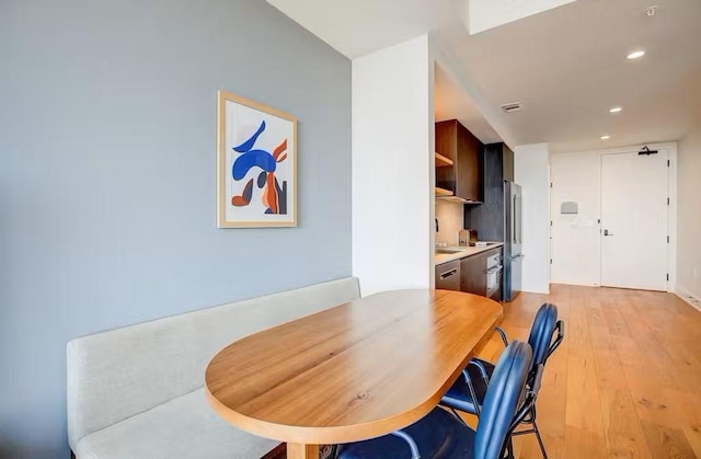 dining room with light hardwood / wood-style flooring