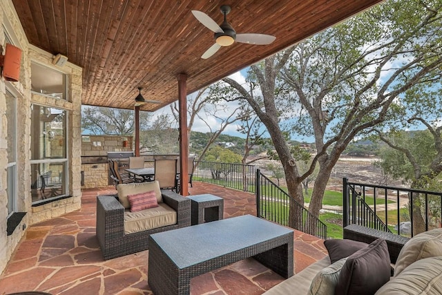 view of patio featuring an outdoor living space and ceiling fan